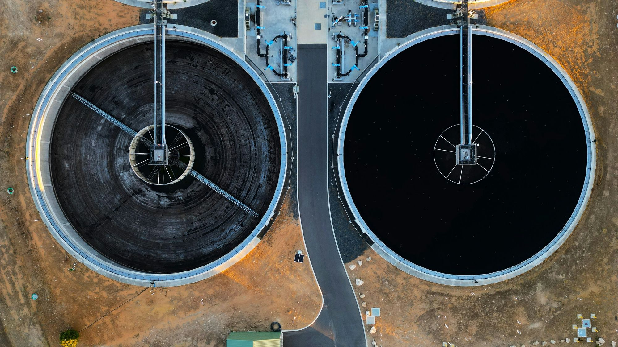 Aerial view of two clarifiers at a wastewater treatment plant